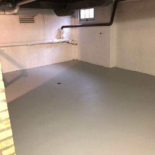 Basement floor refinished with cement grey.