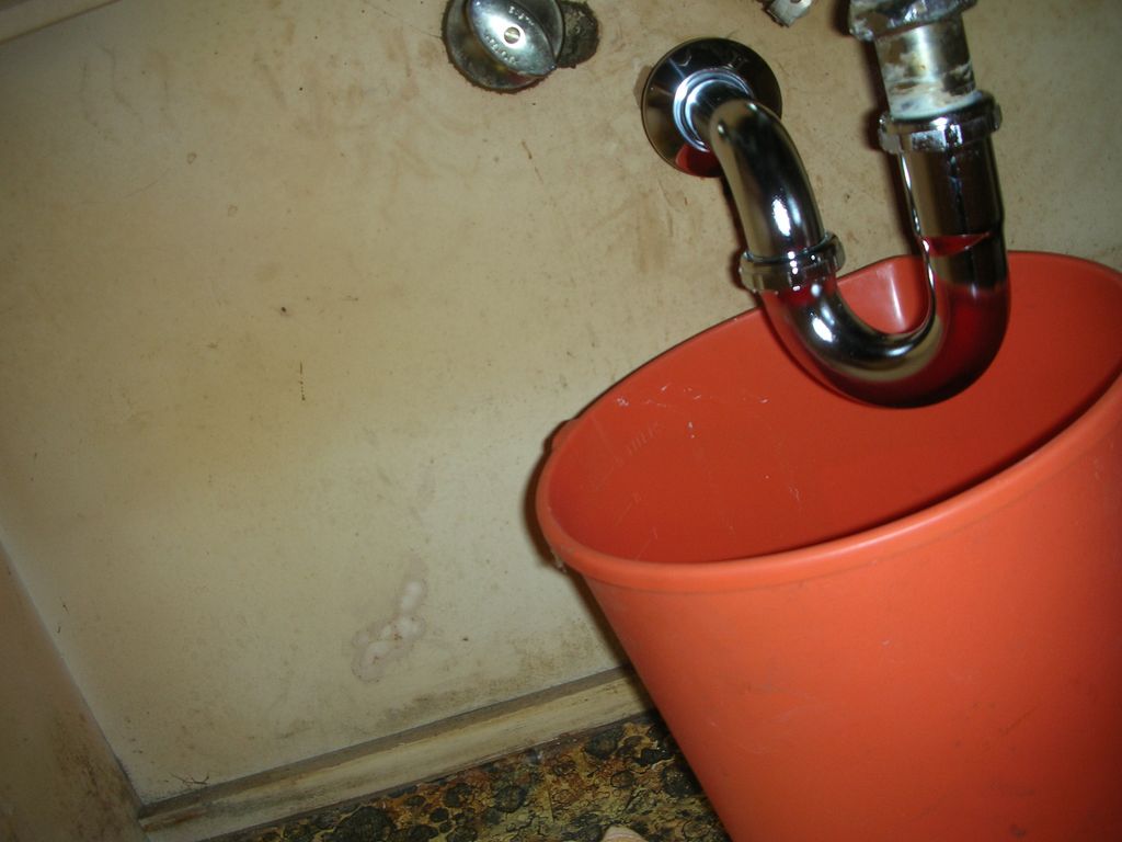 leaky plumbing below sink