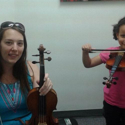 Very first time holding the violin for this little