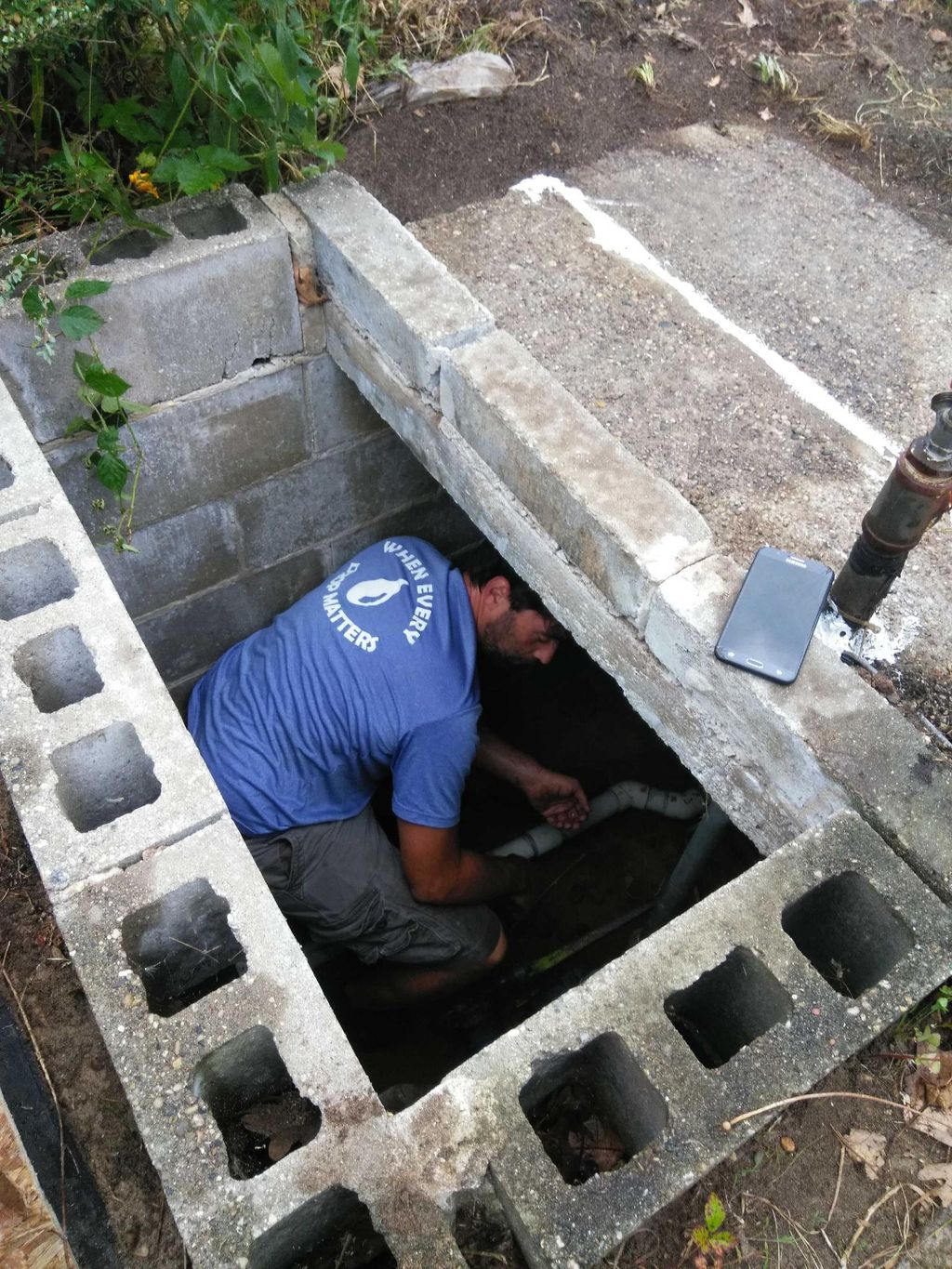 Working on an underground pump
