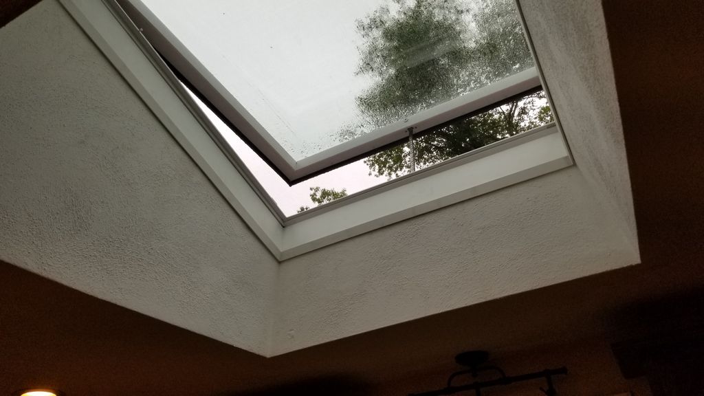 Solar powered remote operating skylight.