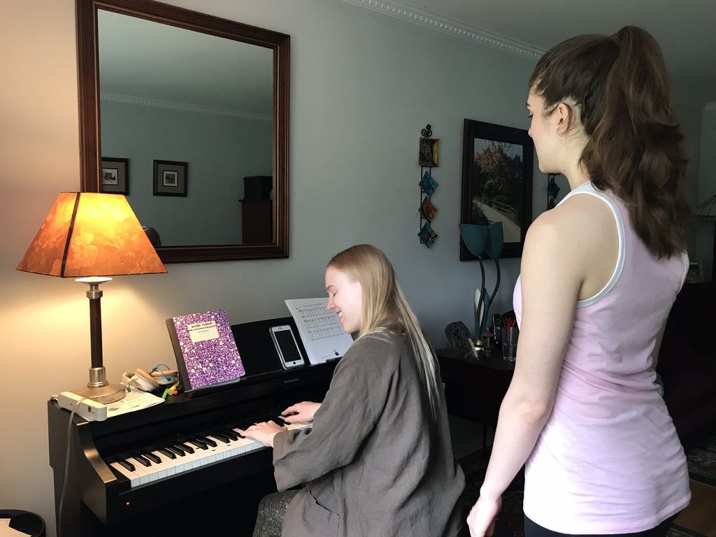 Orla accompanies Megan as she warms up her singing