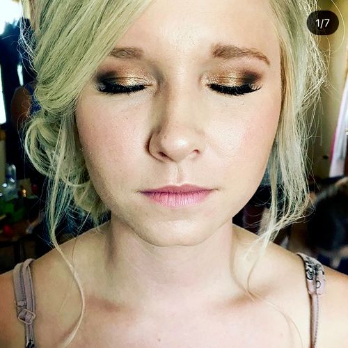 Gorgeous bridesmaid with a gold smokey eye and nud