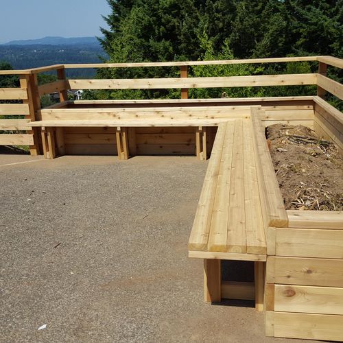 Cedar planter box and built in benches. 4 rail poo