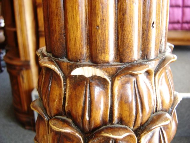 Damaged wood bed post on Furniture Store's Showroo