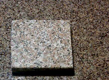 Which sample (top or bottom) is slab granite, and 