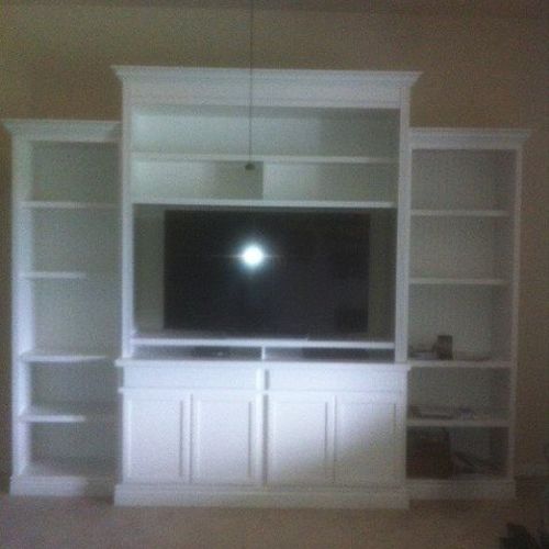 Solid wood entertainment center. 11' long and 9.5'