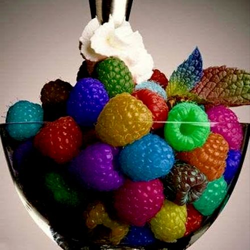colored rasberries with whipped cream topping and 