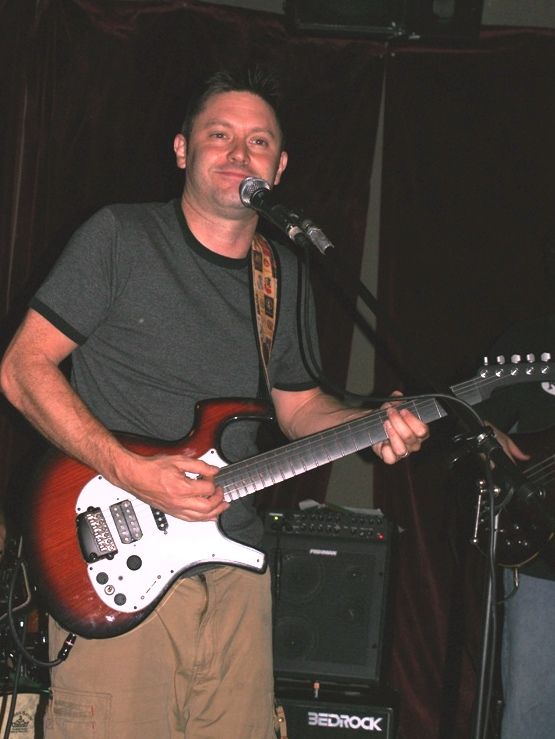 Conor performing with his band at a Boston club