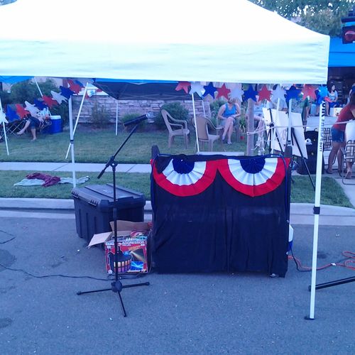 Booth Set up at a 4th of July Block Party 
The ent
