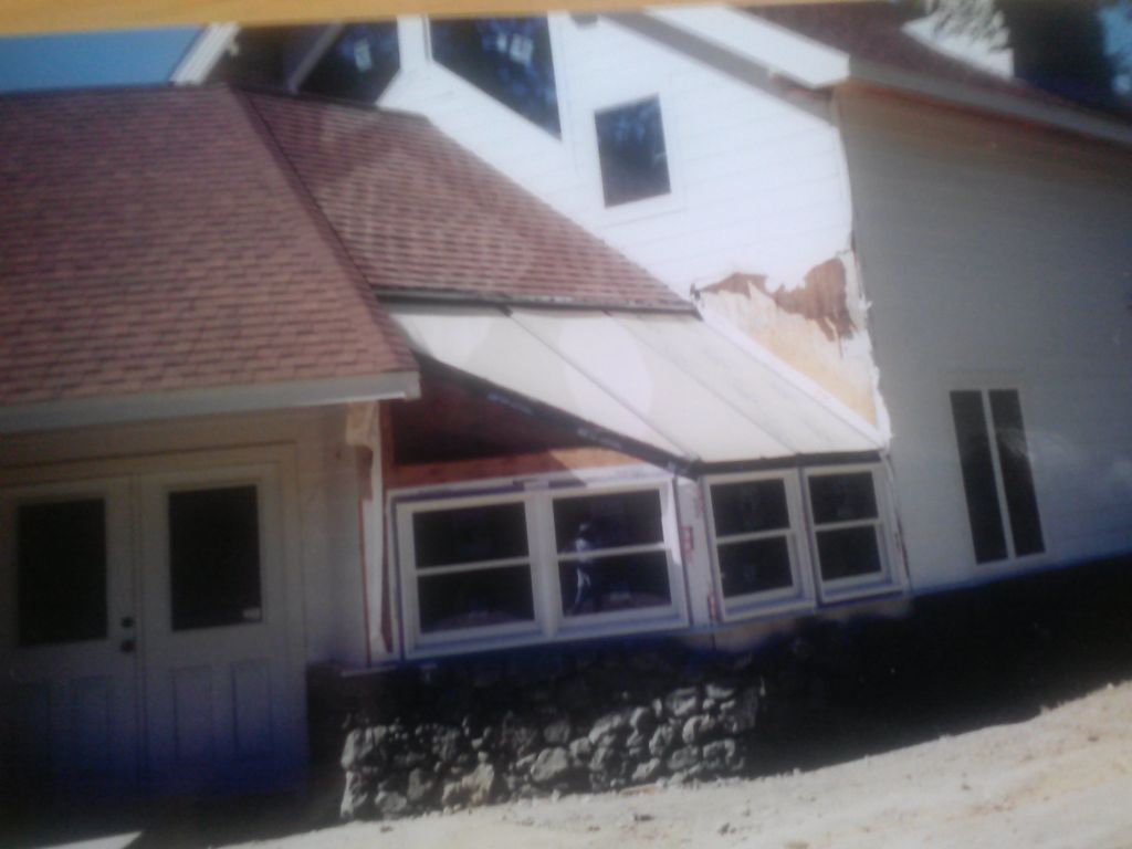 ext. of mountain home shows sunroom