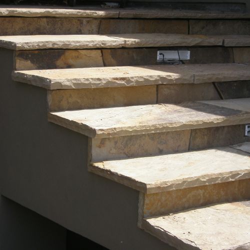 Stone veneer including stone steps, patios, walls,