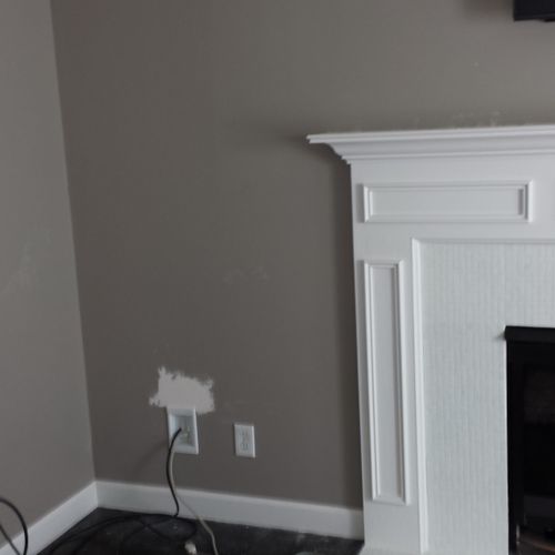 Hide wires and install television over fireplace.