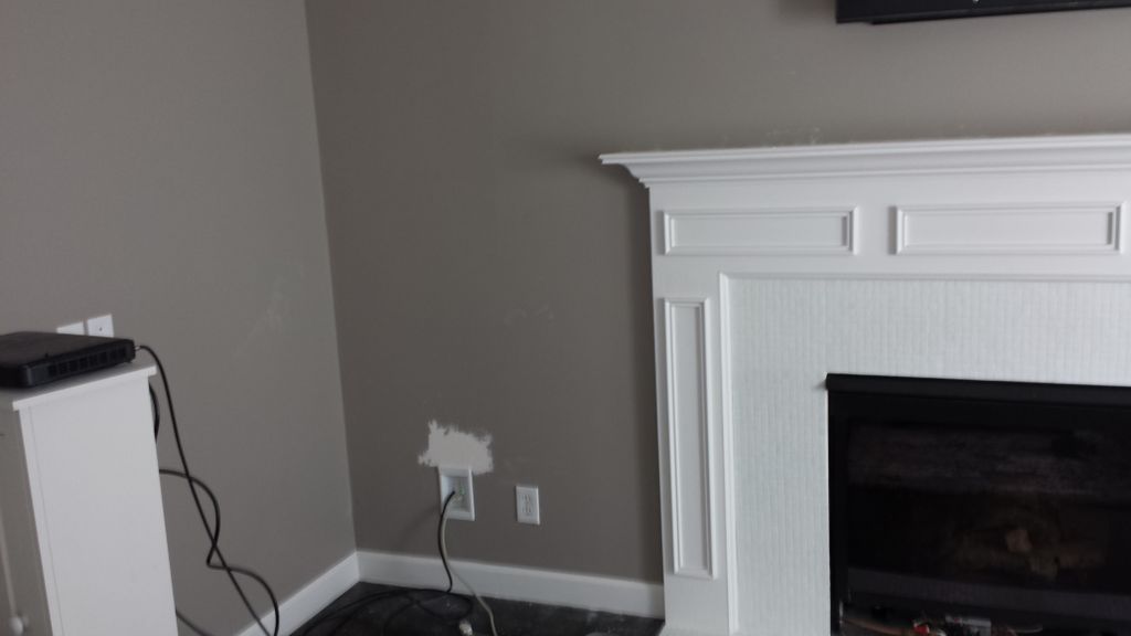 Hide wires and install television over fireplace.