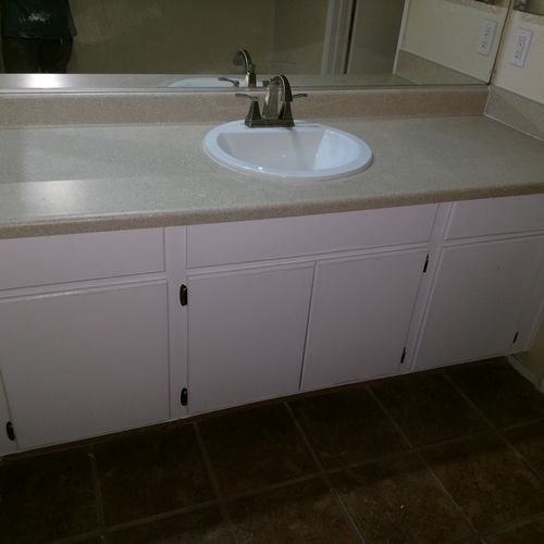 Removed old countertop, sink and faucet. Replaced 