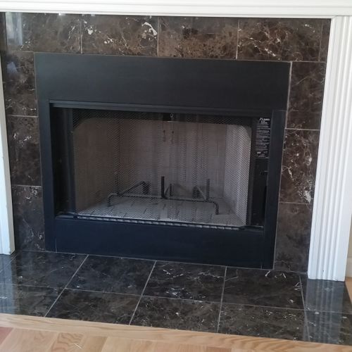 New tile over brick fireplace