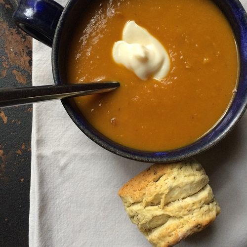 Pumpkin soup and biscuits.