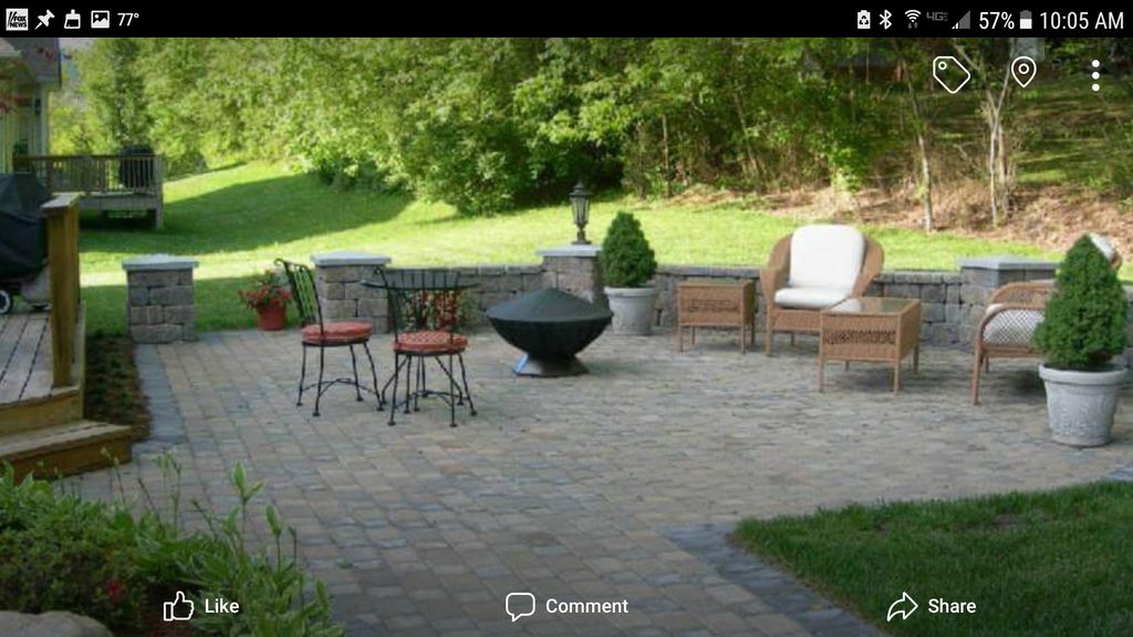 Backyard paver patio with retaining wall and colum