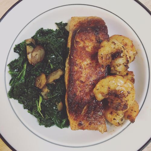Seared Salmon and shrimp with spicy kale and mushr