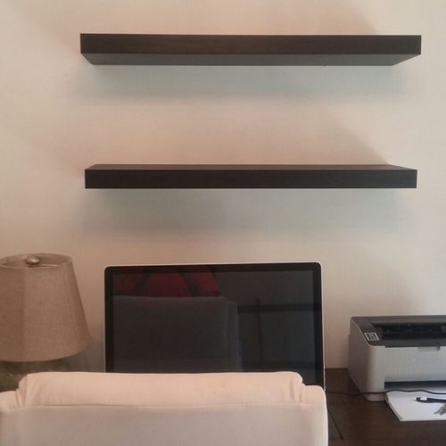wooden shelves installed concrete wall