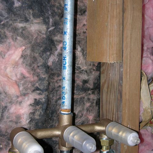 Repairing and updating old plumbing work with tech