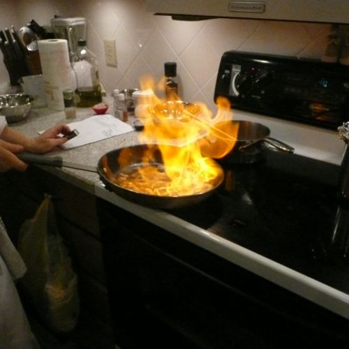 Cooking in a clients kitchen - the art of flambe.