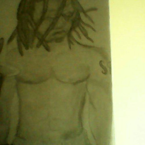 This is a sketch of a man, his dreads in his face.