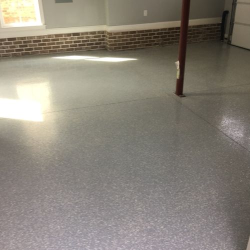 This photo shows a large section of a garage floor