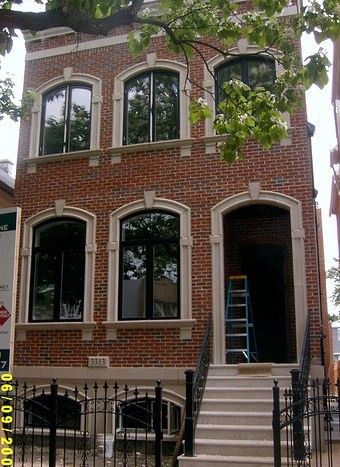 Elegant limestone accents on a solid brick custom 
