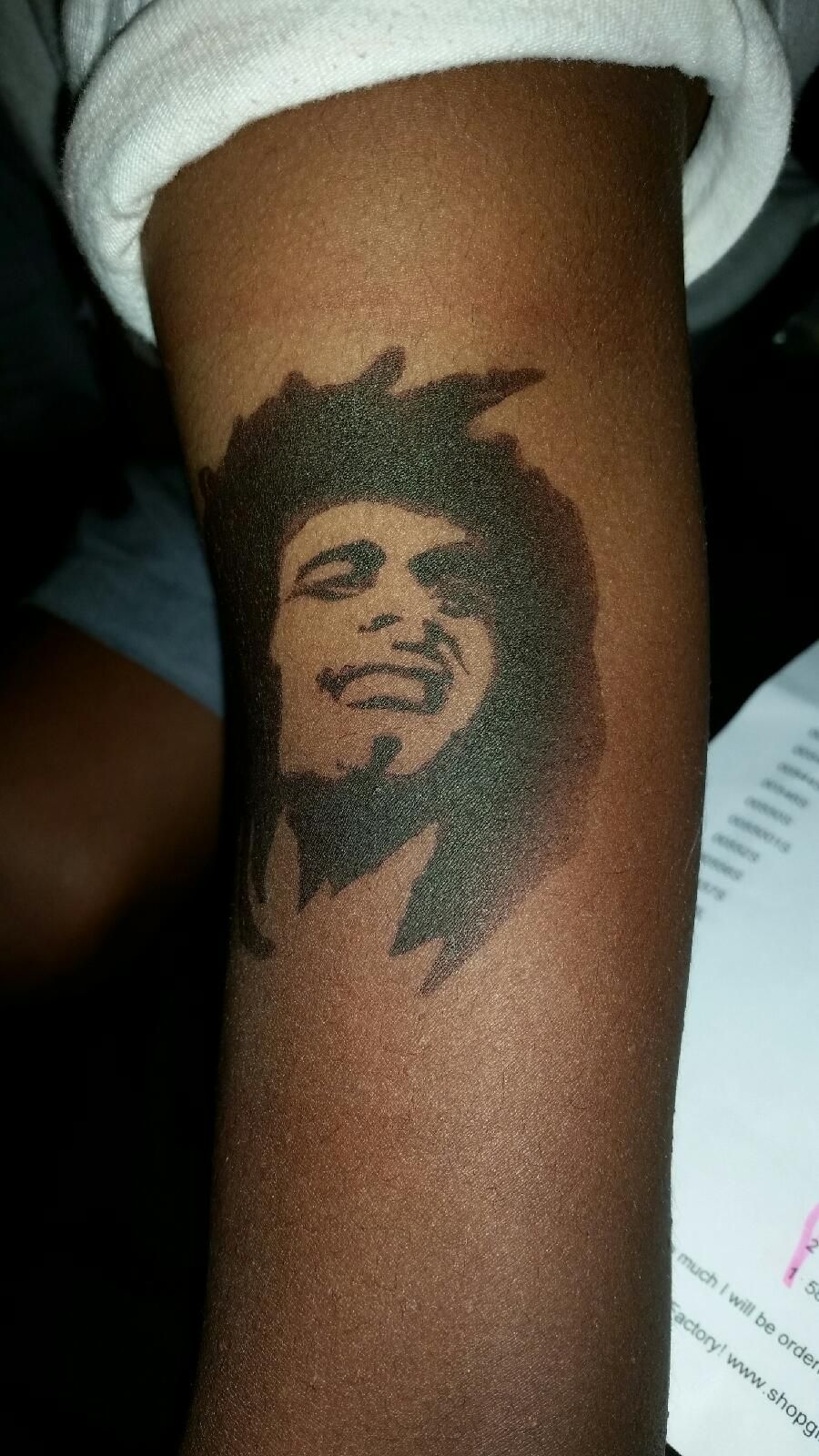 Airbrushed tattoo of Bob Marley