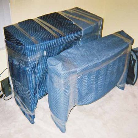 Each furniture piece individually wrapped in quilt