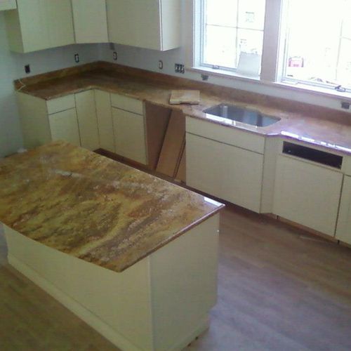 White cabinets with coffee granite countertop and 