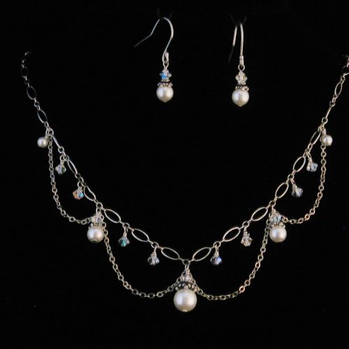 Swarovski crystal pearls and crystals dangle from 