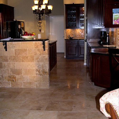 Travertine marble kitchen floor and up the cabinet