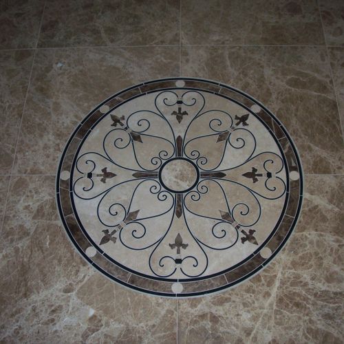 Water jet cut medallion installed on an entry way.