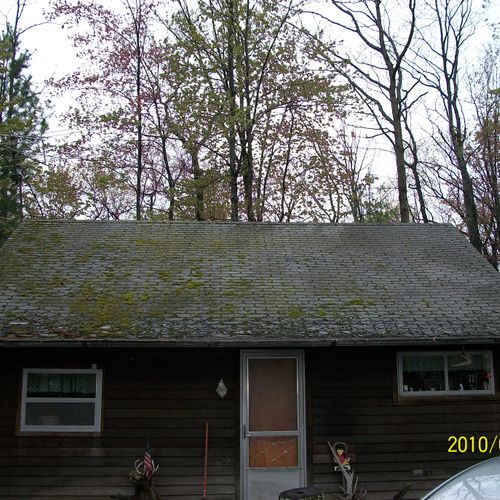 the cabin before new roof