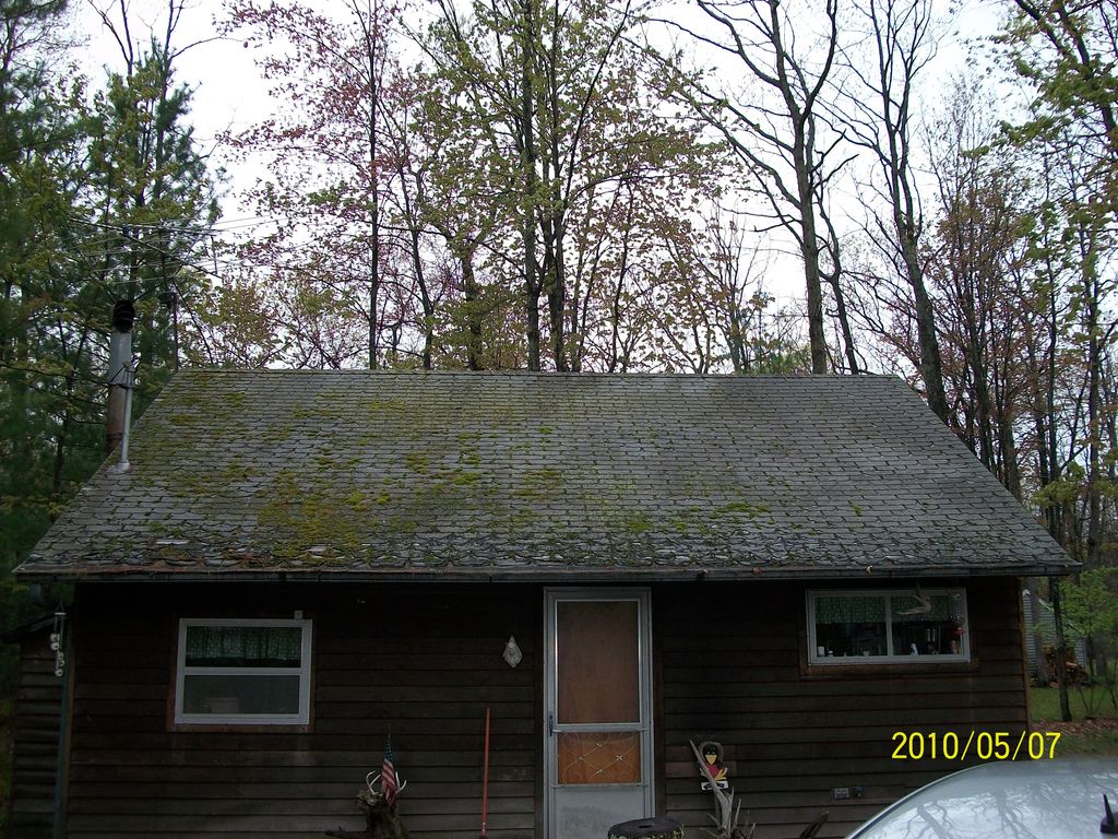 the cabin before new roof