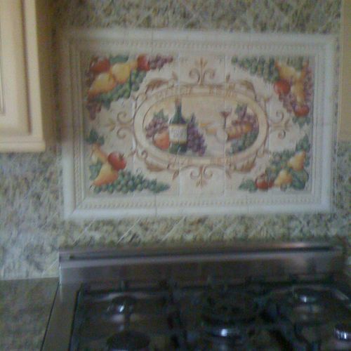 Hand painted tile mural in Spanish addition and co