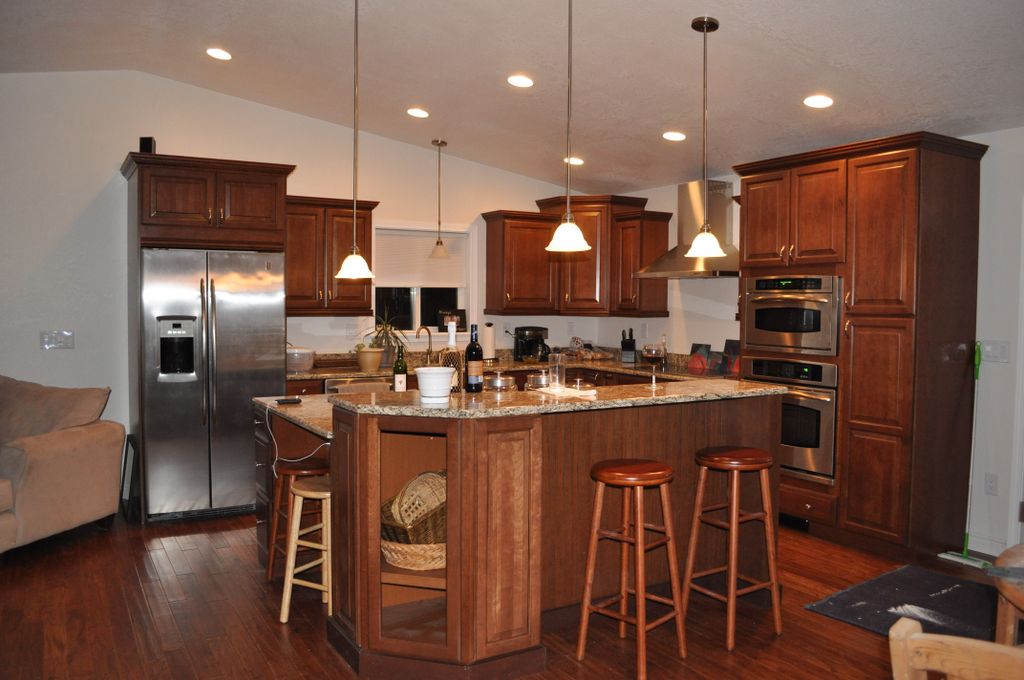 Kitchen After.  Removed the wall, new lighting, ca