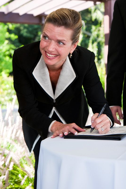 Beverly Mason signing an Oregon marriage certifica