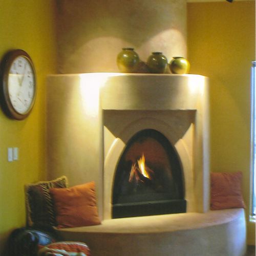 Custom framed and plastered fireplace.