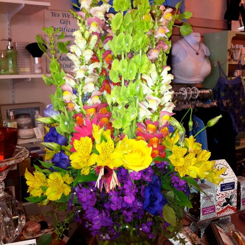An example of a tall vase arrangement, these flowe