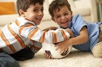 Boys playing on clean carpet