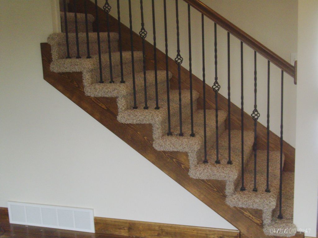 Open sided carpet installation on stairs