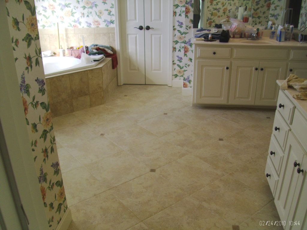 A tile floor with low voltage under floor heat sys