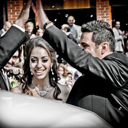Groom and best man give high five and create a fra