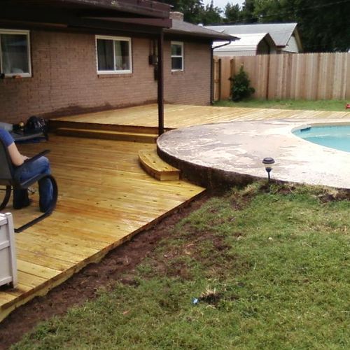 Custom designed deck around an in ground pool.