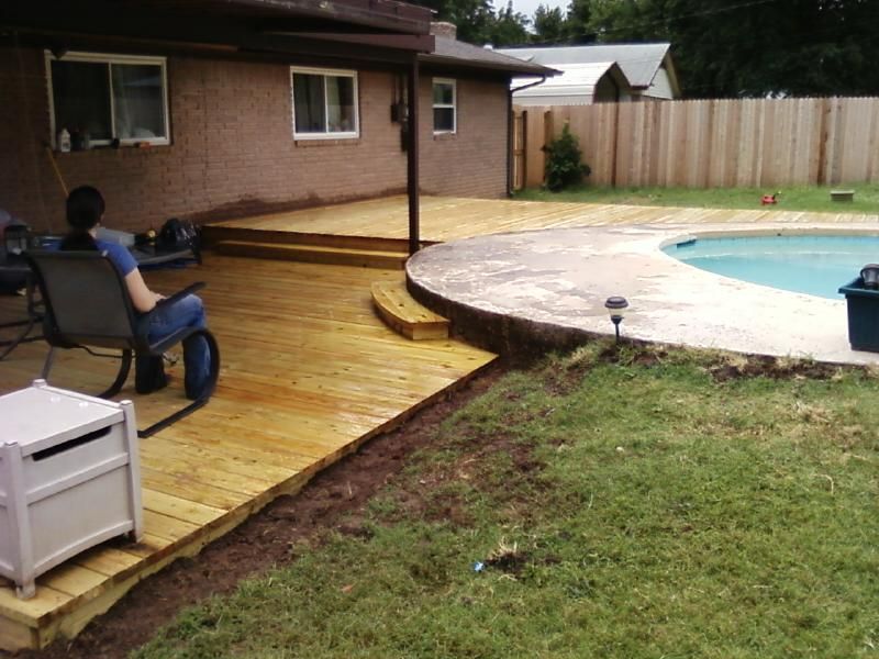 Custom designed deck around an in ground pool.