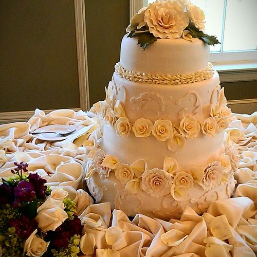 4 tier wedding cake with sugarpaste roses and Call