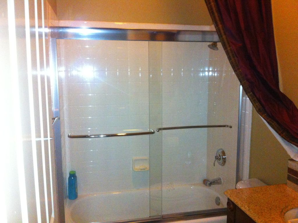 New shower doors, bathroom painting & new baseboar